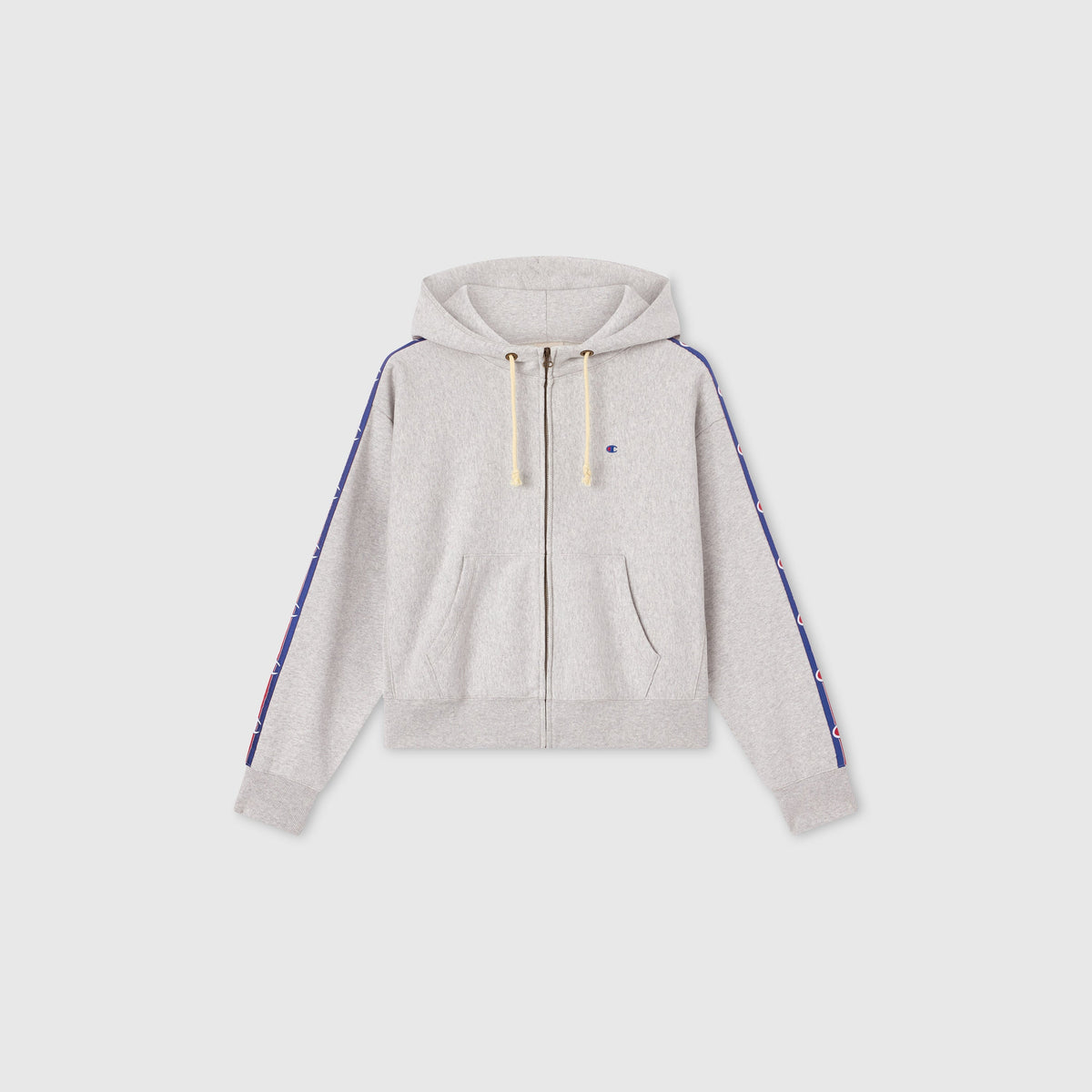 The Women’s Icon Hooded Full Zip Sweatshirt by Champion is a light gray heavyweight fleece zip-up hoodie with a hood and drawstrings, featuring small logos along blue stripes down each sleeve. This hoodie has front pockets and ribbed cuffs and hem, displayed on a plain white background.