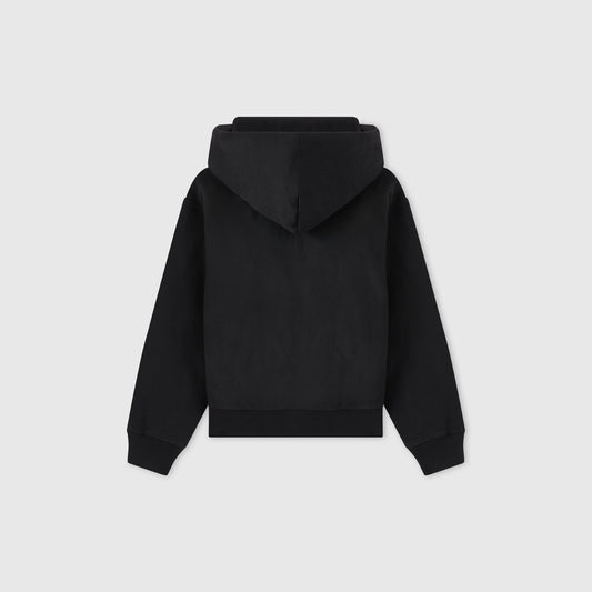 A plain black Women’s Icon Hooded Full Zip Sweatshirt by Champion is shown from the back, with the hood up and sleeves spread outward, against a light gray background.