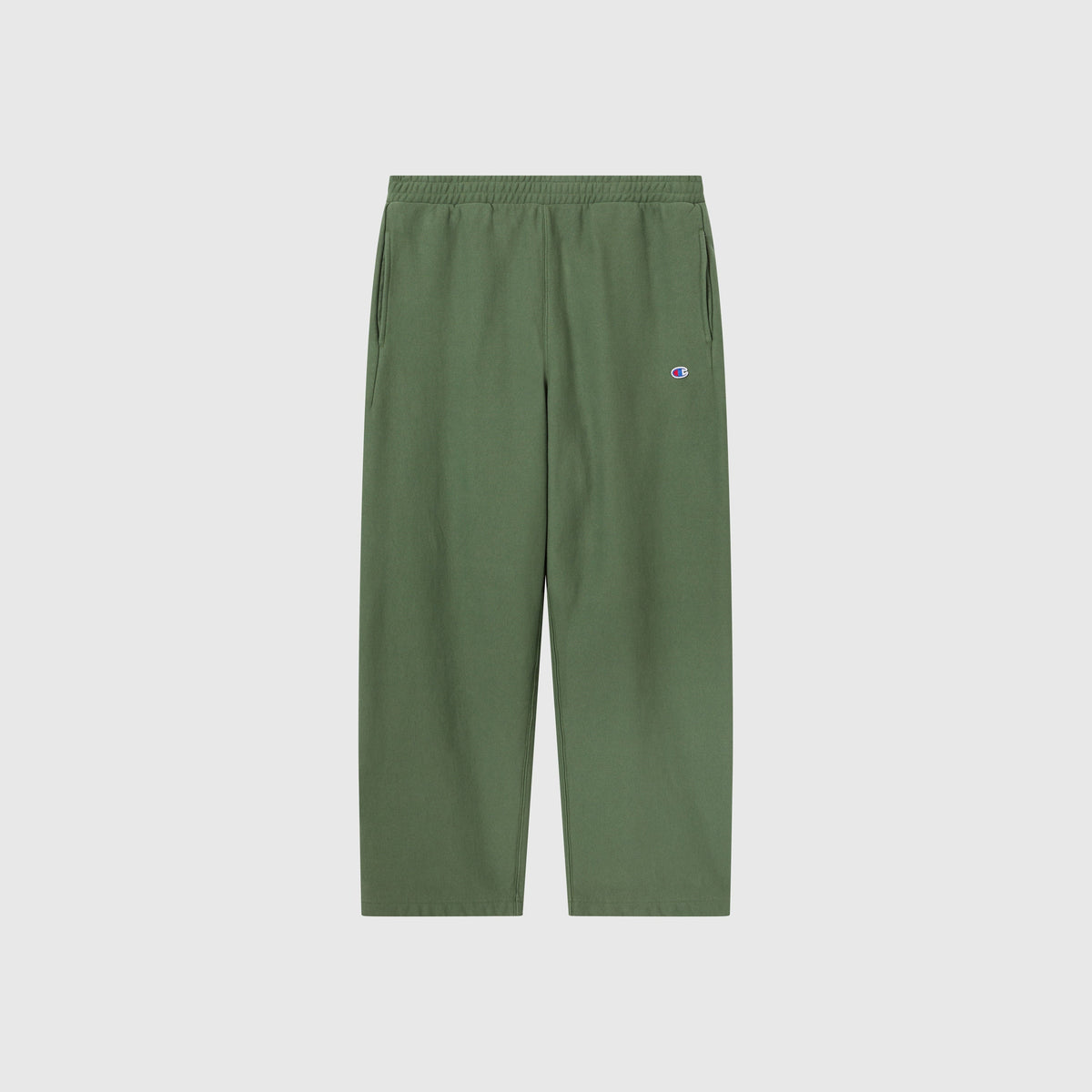 Champion Men’s Knitted Wide Leg Pants, featuring an elastic waistband and side pockets, are shown against a plain white background. A small Champion logo patch is located on the upper left thigh.