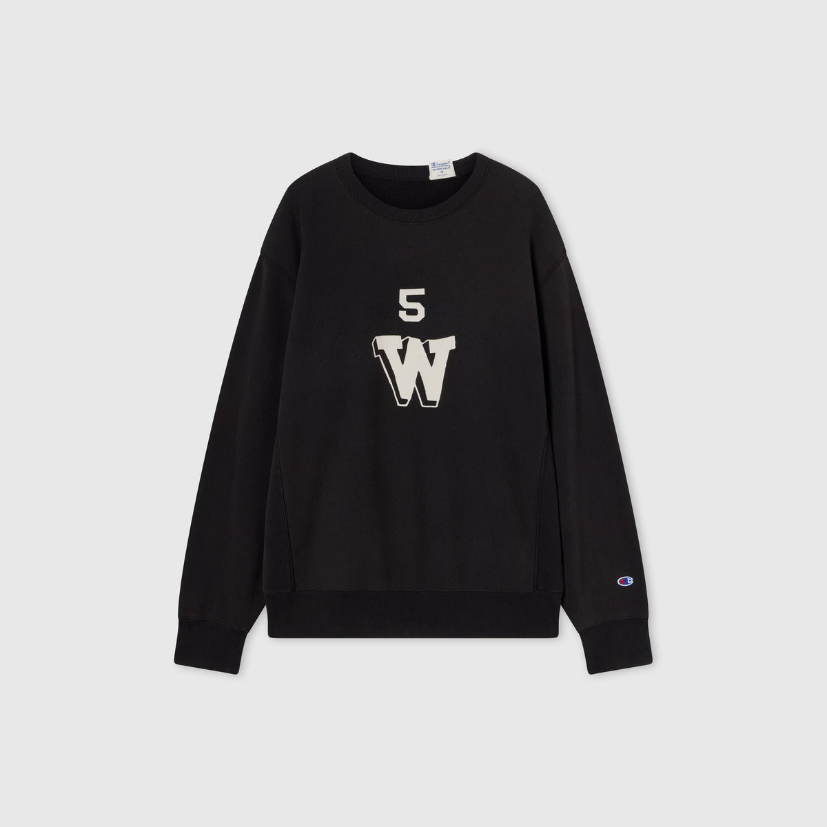 A black Men’s Knitted Crewneck Sweatshirt by Champion, crafted with a vintage wash and reversible design. Made from Champion’s signature Reverse Weave fleece, it features a bold white “W” with the number 5 above it on the front, along with the Champion logo on the left sleeve.
