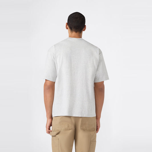 A person stands facing away from the camera, wearing a Champion Men’s Knitted T-Shape Tee in light gray and tan cargo pants, against a plain white background.