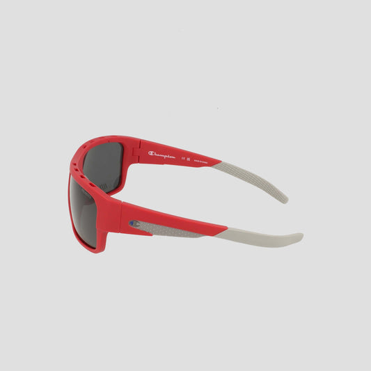 Men's Polarized Grilamid Flex Grip Tip - Large sunglasses by Champion, shown in red and gray with dark lenses, featuring a lightweight comfort design and displayed from a side angle on a plain light background.