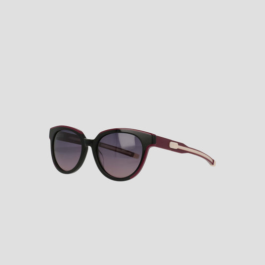 The Champion Women's Polarized Retainer Round sunglasses feature black and dark purple frames with gradient tinted lenses, perfect for women's fashion, displayed on a plain light gray background.