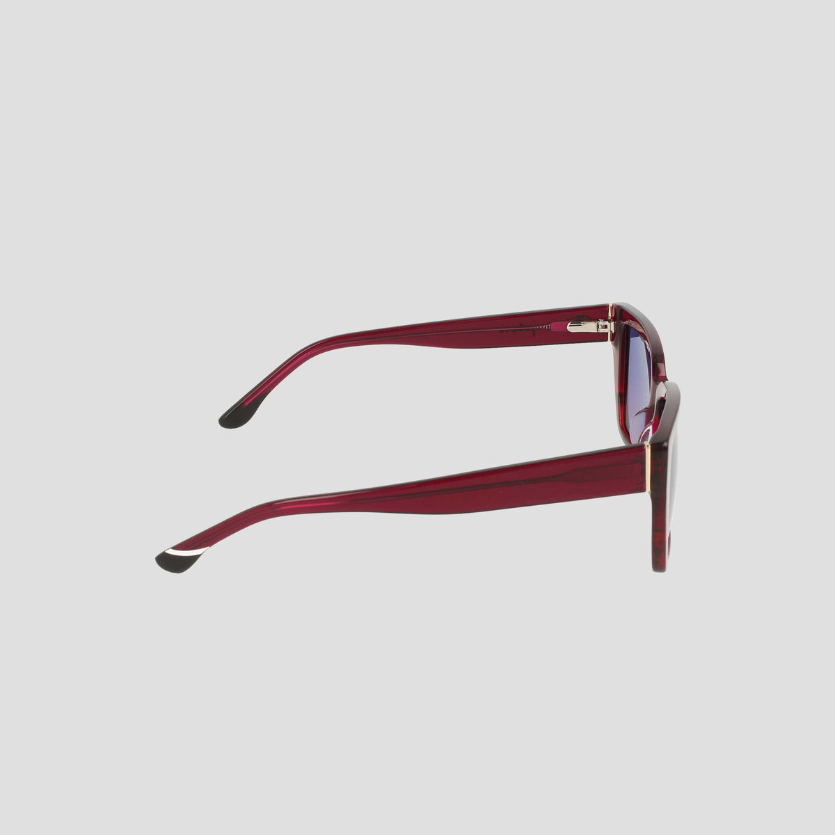 Side view of Champion Women's Polarized Slim Rectangle sunglasses, featuring red frames, dark polarized lenses, and black arm tips against a plain light gray background.