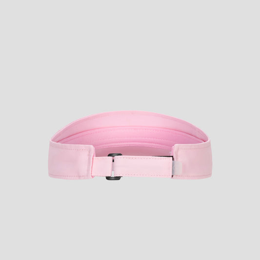 A light pink Champion Adjustable Visor featuring stitching detail, a rectangular black buckle, and a smooth texture offers both style and an adjustable fit, displayed on a plain gray background.