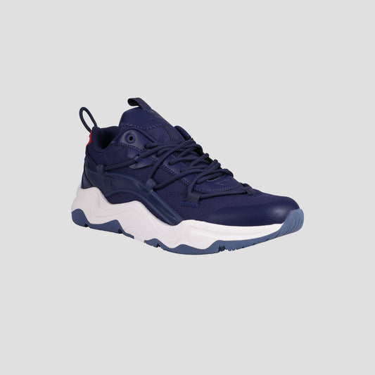 The Champion Men's Hyper C Pilot sneaker features a navy mesh and leather upper, dark blue laces, and a chunky white/light blue sole, displayed at an angle on a plain light gray background.