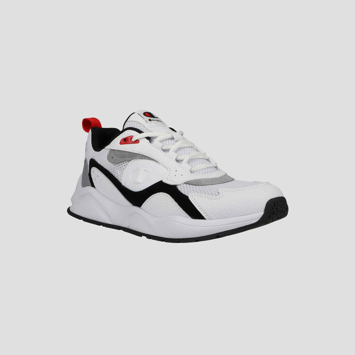 The Champion Men's 9318 Vale is a white athletic sneaker with black and gray accents, red details on the tongue and heel tab, cushioned collar, white laces, and a thick black-and-white rubber sole, shown on a light gray background.