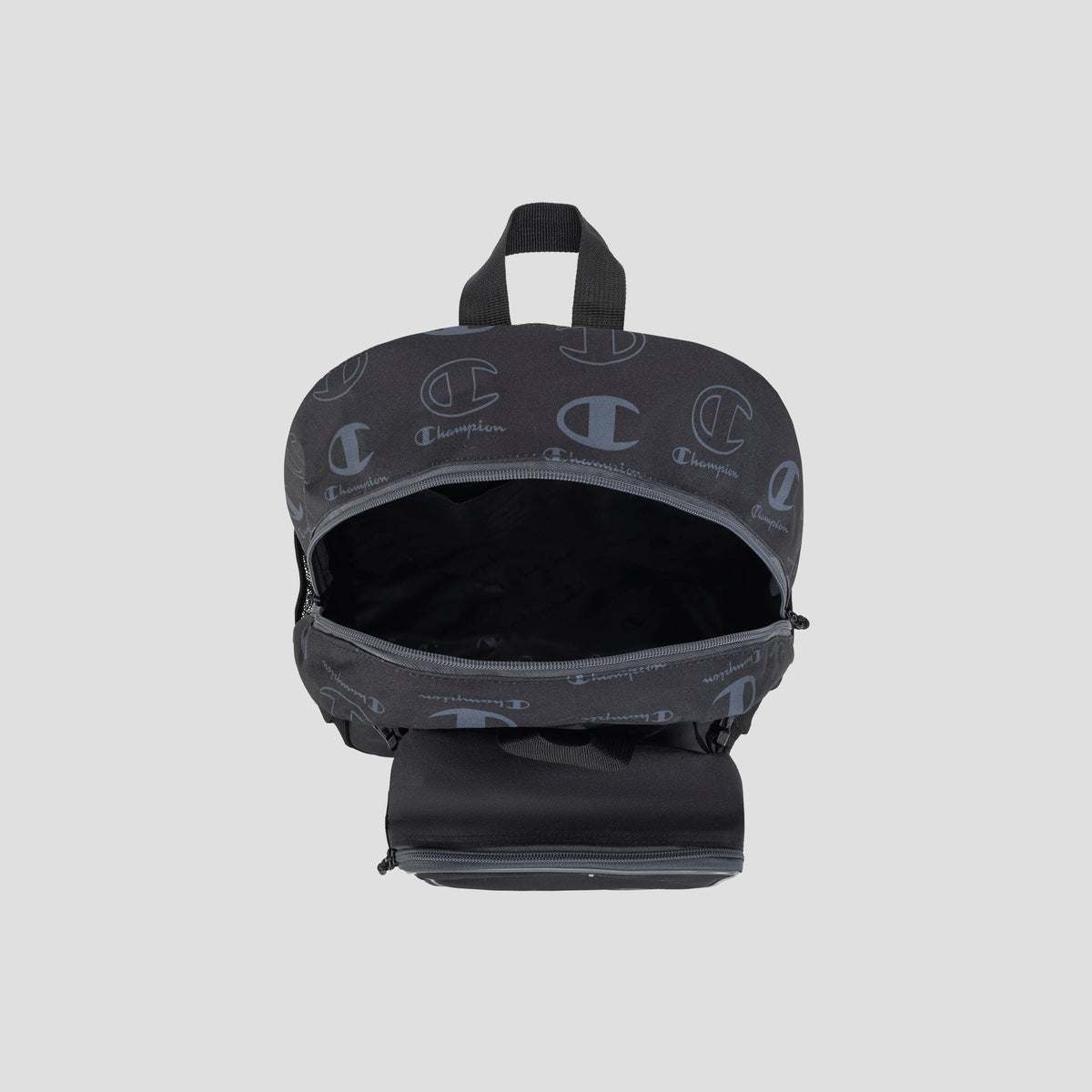 A black Champion Kids’ Mode Lunch Kit & Backpack Combo, featuring a top handle, partially open main compartment, and signature logo pattern on the fabric—ideal for an active lifestyle—displayed against a light gray background.