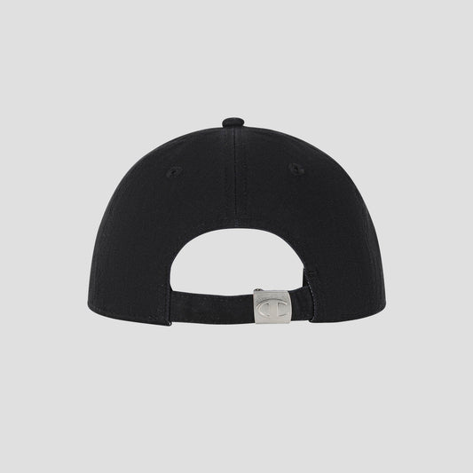 Back view of the Champion Script Embroidery Adjustable Cap in black, crafted from washed cotton twill with an adjustable strap and metallic clasp, featuring a small engraved logo. The background is plain and light gray.