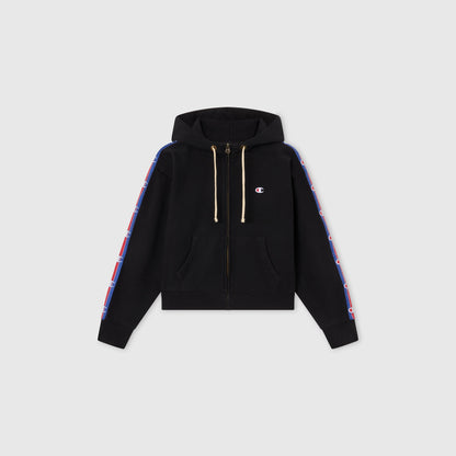 Women’s Icon Hooded Full Zip Sweatshirt by Champion features front pockets, hood drawstrings, and blue-and-red logo stripes on both sleeves. Made from heavyweight fleece and shown on a plain gray background.