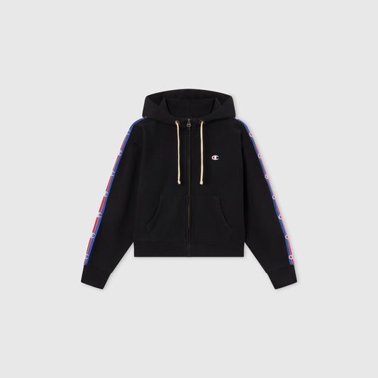 Women’s Icon Hooded Full Zip Sweatshirt by Champion features front pockets, hood drawstrings, and blue-and-red logo stripes on both sleeves. Made from heavyweight fleece and shown on a plain gray background.