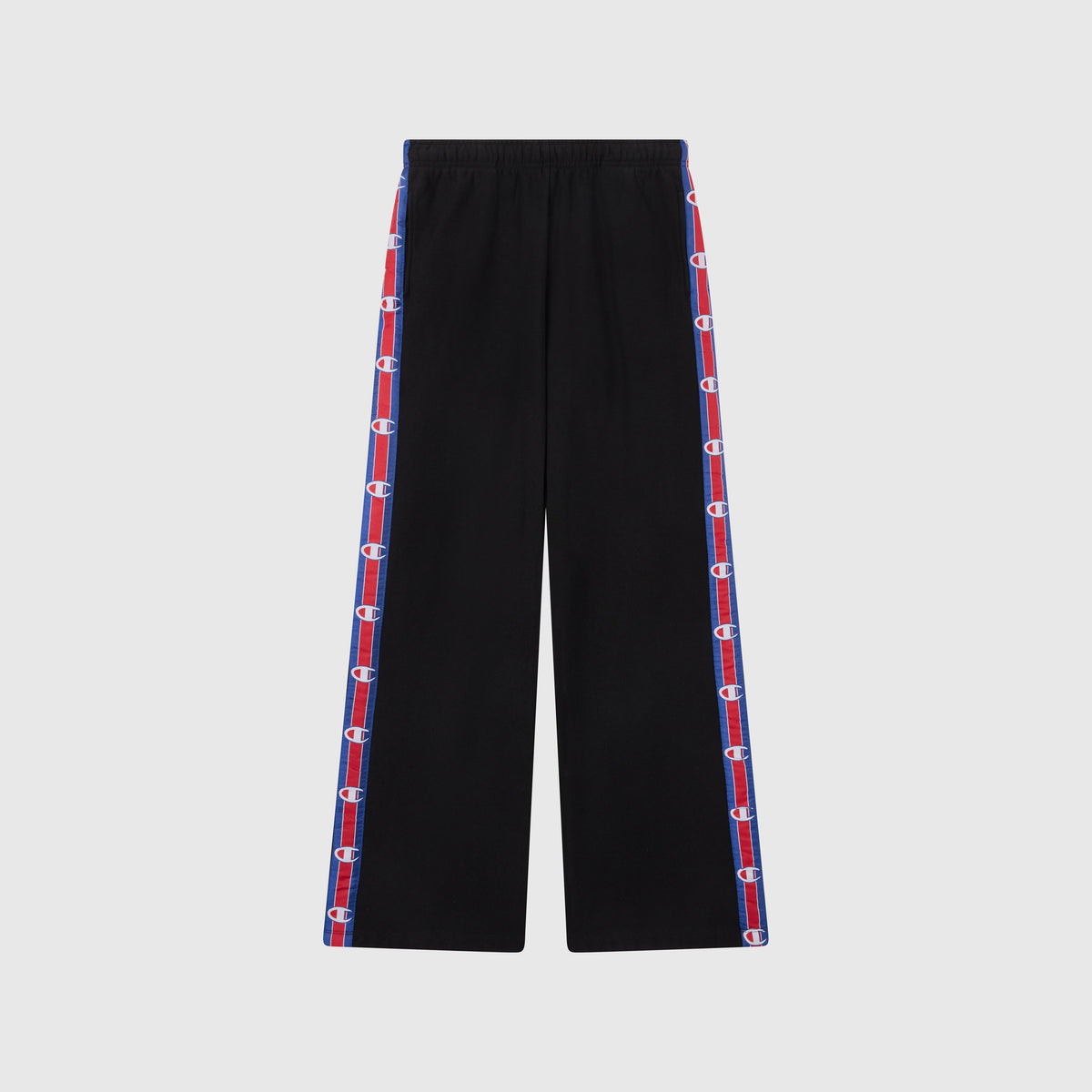 Women’s Knitted Wide Leg Pants by Champion in black, featuring blue and red striped side panels with repeated Champion logos. These pants have a relaxed fit, an elastic waistband, and are photographed against a plain light gray background.