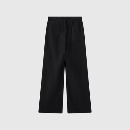 Champion Women’s Knitted Wide Leg Pants with an elastic waistband, shown laid flat on a plain light grey background. These pants feature a simple, minimalist design with no visible pockets or extra details.