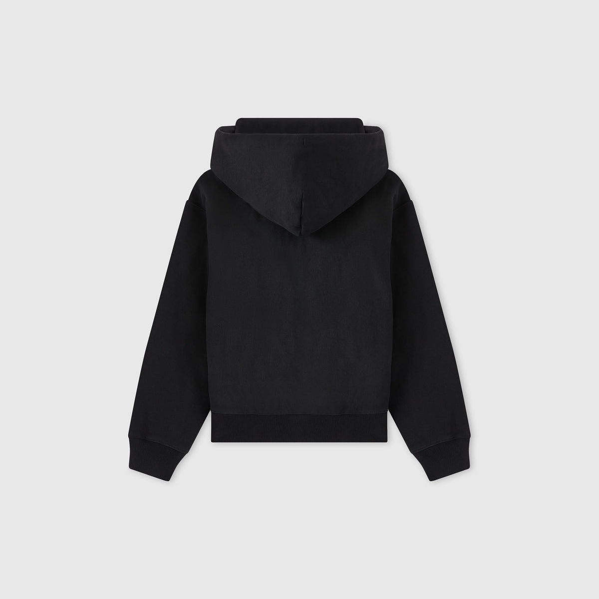A plain black Women’s Icon Hooded Full Zip Sweatshirt by Champion is shown from the back, with the hood up and sleeves spread outward, against a light gray background.