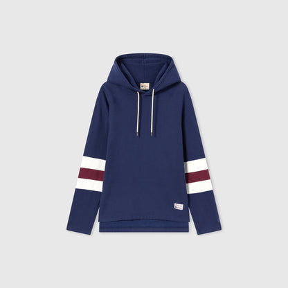This Champion Men’s Knitted Hooded Sweatshirt features a classic navy blue color with a front pocket, white drawstrings, and horizontal white and maroon stripes on both sleeves. Made from heavyweight fleece for enhanced warmth and durability, the hoodie is showcased against a plain light gray background.