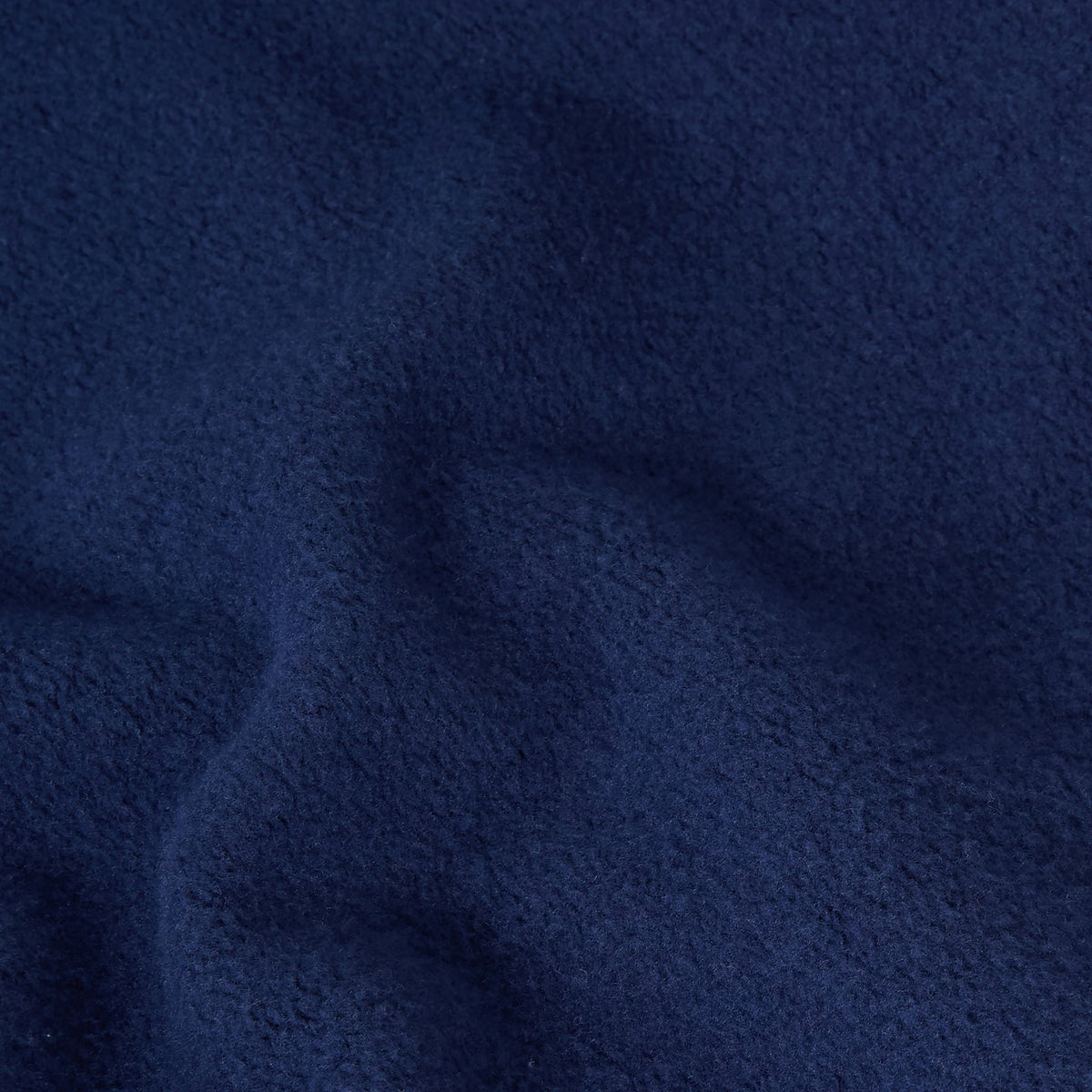 Close-up of dark blue textured fabric from the Champion Men’s Knitted Hooded Sweatshirt, featuring a soft, fuzzy surface and gentle folds that create subtle shadows and highlights.