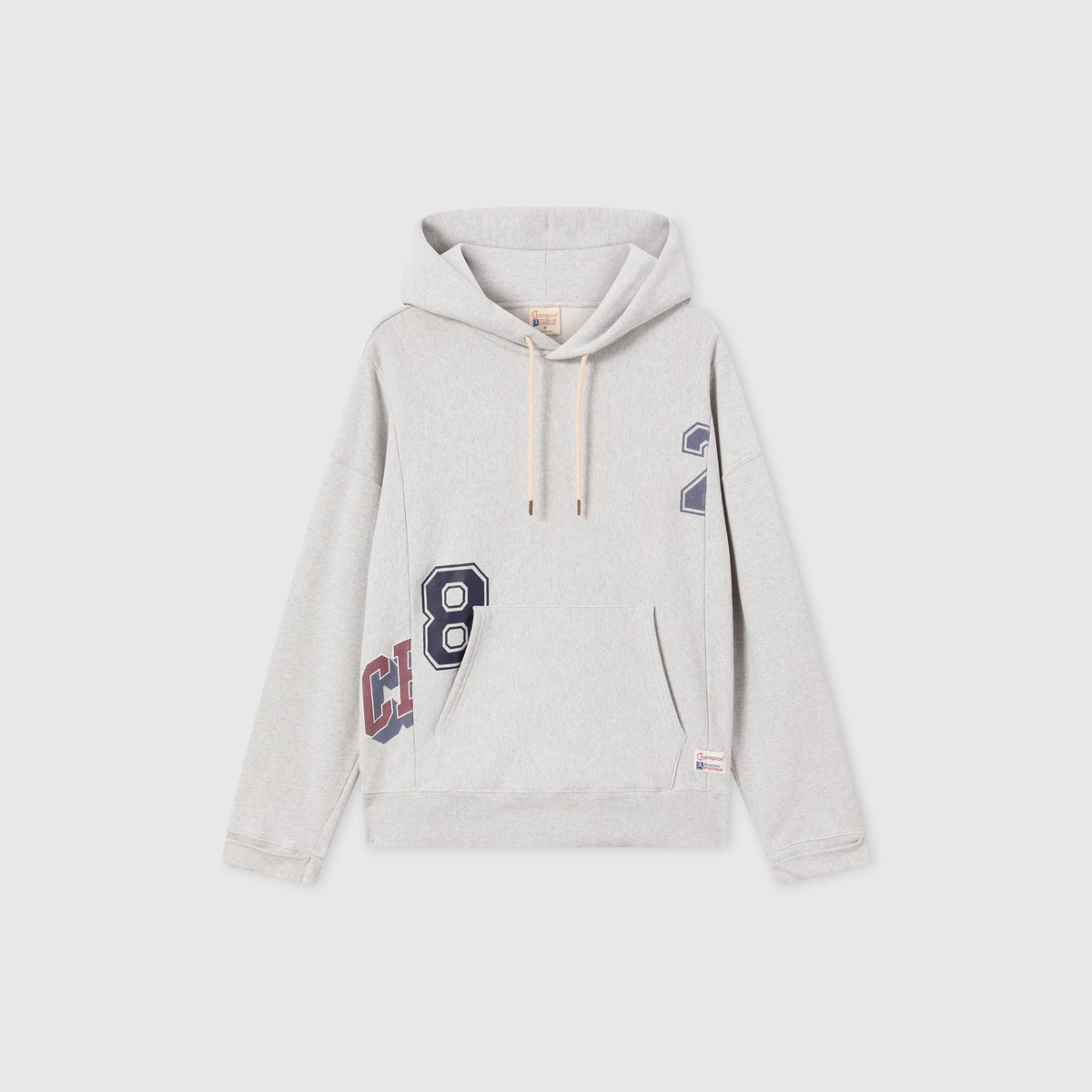 Men’s Knitted Hooded Sweatshirt (College Graphic) by Champion in light gray, featuring cream drawstrings, a navy “8” and “2” print, partial red text on the lower side, and a front kangaroo pocket. Crafted from signature Reverse Weave fleece, this hoodie channels classic college-inspired style against a plain white background.