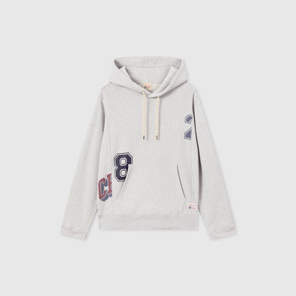 Men’s Knitted Hooded Sweatshirt (College Graphic) by Champion in light gray, featuring cream drawstrings, a navy “8” and “2” print, partial red text on the lower side, and a front kangaroo pocket. Crafted from signature Reverse Weave fleece, this hoodie channels classic college-inspired style against a plain white background.