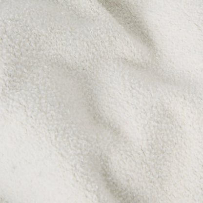 Close-up of a textured, off-white fleece fabric from the Champion Men’s Knitted Hooded Sweatshirt (College Graphic), featuring soft folds and a subtly bumpy surface that evokes the cozy sophistication of college-inspired style.