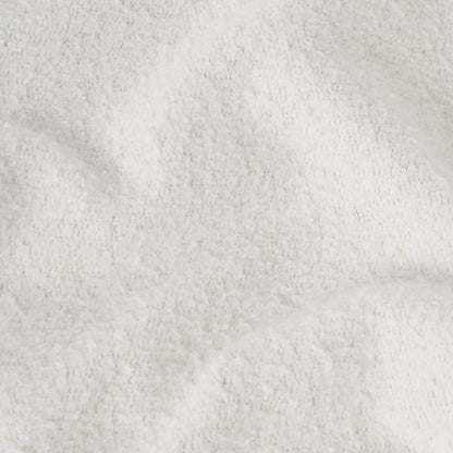 Close-up of a soft, white, textured fabric with gentle folds and a slightly fluffy appearance—evoking the cozy comfort characteristic of the Champion Men’s Knitted Polo Neck Sweatshirt.
