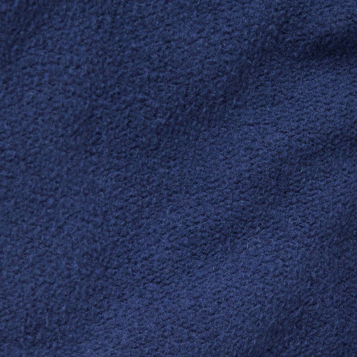 Close-up of dark blue fleece fabric from Champion’s Men’s Knitted Elastic Cuff Pants, highlighting its soft, textured surface and subtle variations in color and weave—an ideal material for comfort and style.