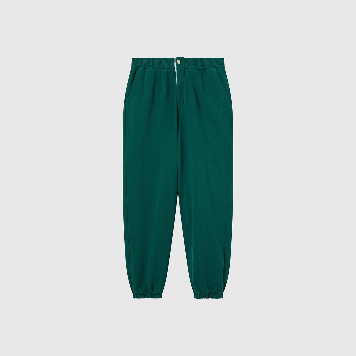 Men’s Knitted Elastic Cuff Pants by Champion, inspired by the Modern Ametora trousers, feature an elastic waistband, side pockets, elastic ankle cuffs, and a button closure. Shown on a plain light gray background.
