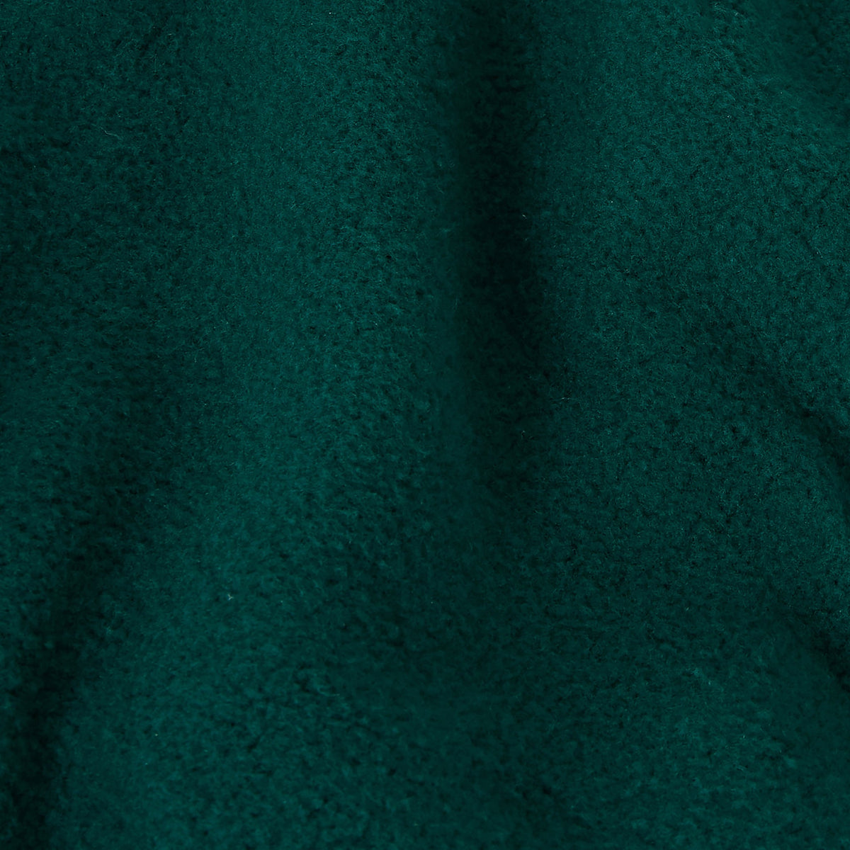 Close-up of a textured, dark green fabric with a soft, uneven surface and visible fibers, evoking a cozy and warm look—much like the plush comfort of Champion Men’s Knitted Elastic Cuff Pants.