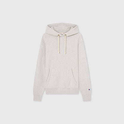 Men’s Knitted Hooded Sweatshirt by Champion in light gray, showcasing a classic Reverse Weave design with a front pouch pocket, drawstring hood, and long sleeves, presented against a plain white background.