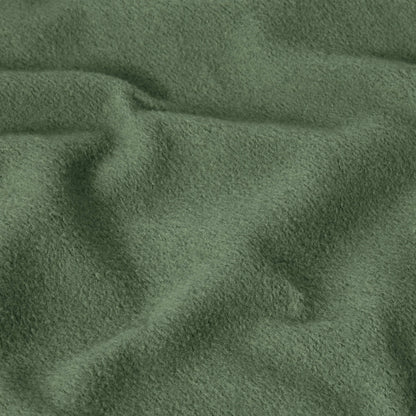 Close-up of green, soft, textured fabric with visible folds and gentle wrinkles, creating a cozy and slightly uneven surface—characteristic of the heavyweight fleece used in the Champion Men’s Relaxed Fit Hooded Sweatshirt.