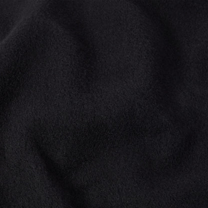 Close-up of soft, deep black fabric with a subtly fuzzy texture and gentle folds, evoking the feel of a classic Champion Men’s Knitted Crewneck Sweatshirt.