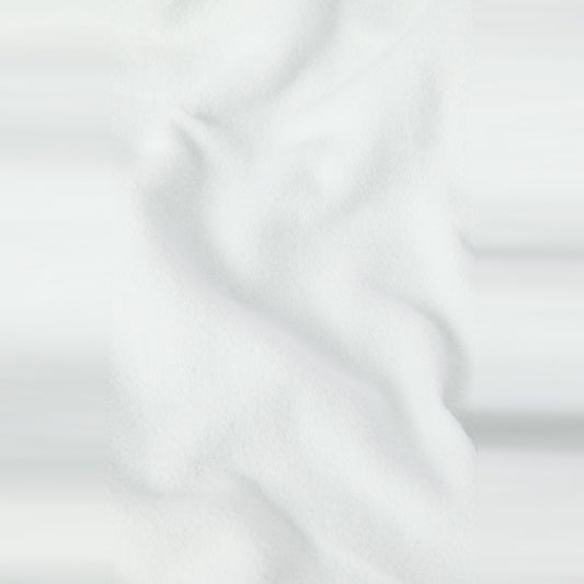 A close-up of soft, white fabric with gentle folds and subtle shadows, evoking the smooth, textured appearance of heavyweight fleece found in the Champion Men’s Knitted Hooded Sweatshirt (Embroidered Logo).