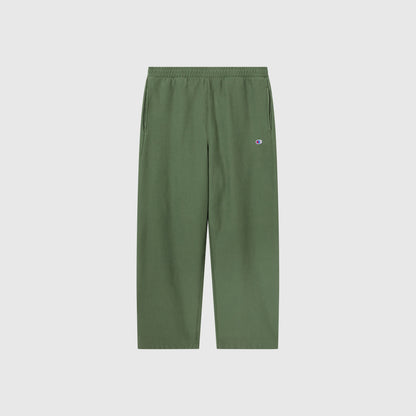 Champion Men’s Knitted Wide Leg Pants, featuring an elastic waistband and side pockets, are shown against a plain white background. A small Champion logo patch is located on the upper left thigh.