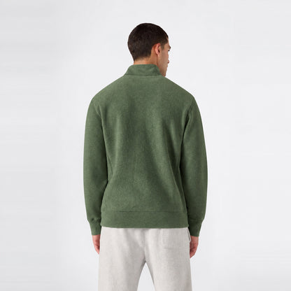 Back view of a person wearing a green Champion Men’s Knitted Half Zip Sweatshirt and grey sweatpants.