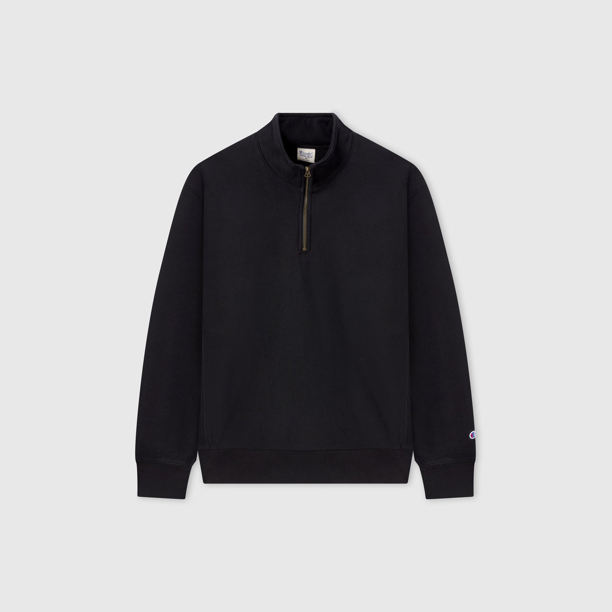 A Champion Men’s Knitted Half Zip Sweatshirt in plain black, featuring a stand-up collar and silver half-zip closure, is displayed against a light gray background.