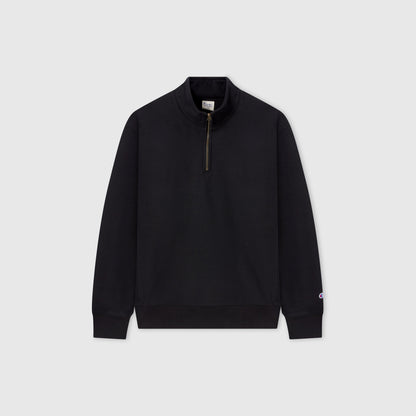 A Champion Men’s Knitted Half Zip Sweatshirt in plain black, featuring a stand-up collar and silver half-zip closure, is displayed against a light gray background.