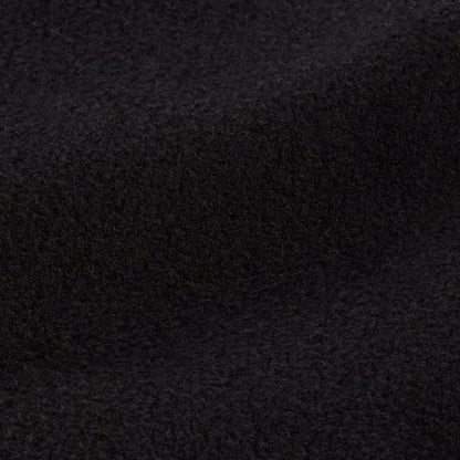 A close-up of a textured, dark, fuzzy fabric—displaying the soft and slightly uneven surface of the Champion Men’s Knitted Half Zip Sweatshirt—with gentle folds and subtle shadows, evoking a sense of coziness.