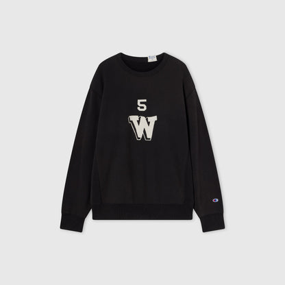 A black Men’s Knitted Crewneck Sweatshirt by Champion, crafted with a vintage wash and reversible design. Made from Champion’s signature Reverse Weave fleece, it features a bold white “W” with the number 5 above it on the front, along with the Champion logo on the left sleeve.