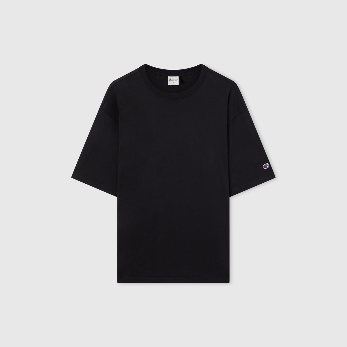 A men’s Champion Knitted T-Shape Tee in plain black, featuring short sleeves and heavyweight cotton fabric, with a small logo on the left sleeve, displayed on a white background.