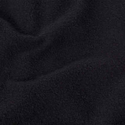 A close-up view of soft, black heavyweight fleece fabric with gentle folds and a slightly textured, fuzzy surface, reminiscent of the quality found in Champion Men’s Knitted Shorts—a staple in men’s sportswear.