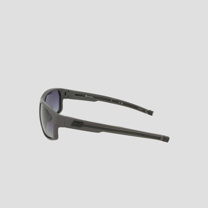 Side view of the Champion Men's Polarized Rectangle Retainer Wrap - Medium sunglasses in black, featuring thick arms and a modern, sporty design with dark tinted polarized lenses for enhanced visual clarity, displayed against a light gray background.