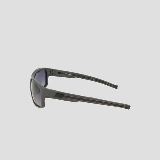 Side view of the Champion Men's Polarized Rectangle Retainer Wrap - Medium sunglasses in black, featuring thick arms and a modern, sporty design with dark tinted polarized lenses for enhanced visual clarity, displayed against a light gray background.