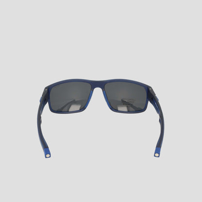 A pair of Champion Men's Polarized Rectangle Retainer Wrap sunglasses in blue, featuring dark polarized lenses, is displayed from the rear angle against a plain light gray background.