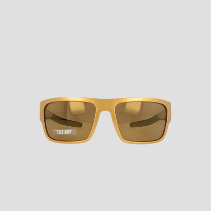 Champion Men's Polarized Grilamid Flex Grip Tip - Large sunglasses in yellow rectangular frames, featuring brown tinted polarized lenses. "FLEX GRIP" is printed in white on the lower corner of the left lens. Designed by Champion for lightweight comfort, these sunglasses also have an RX-able frame for added versatility, and are shown against a plain light grey background.