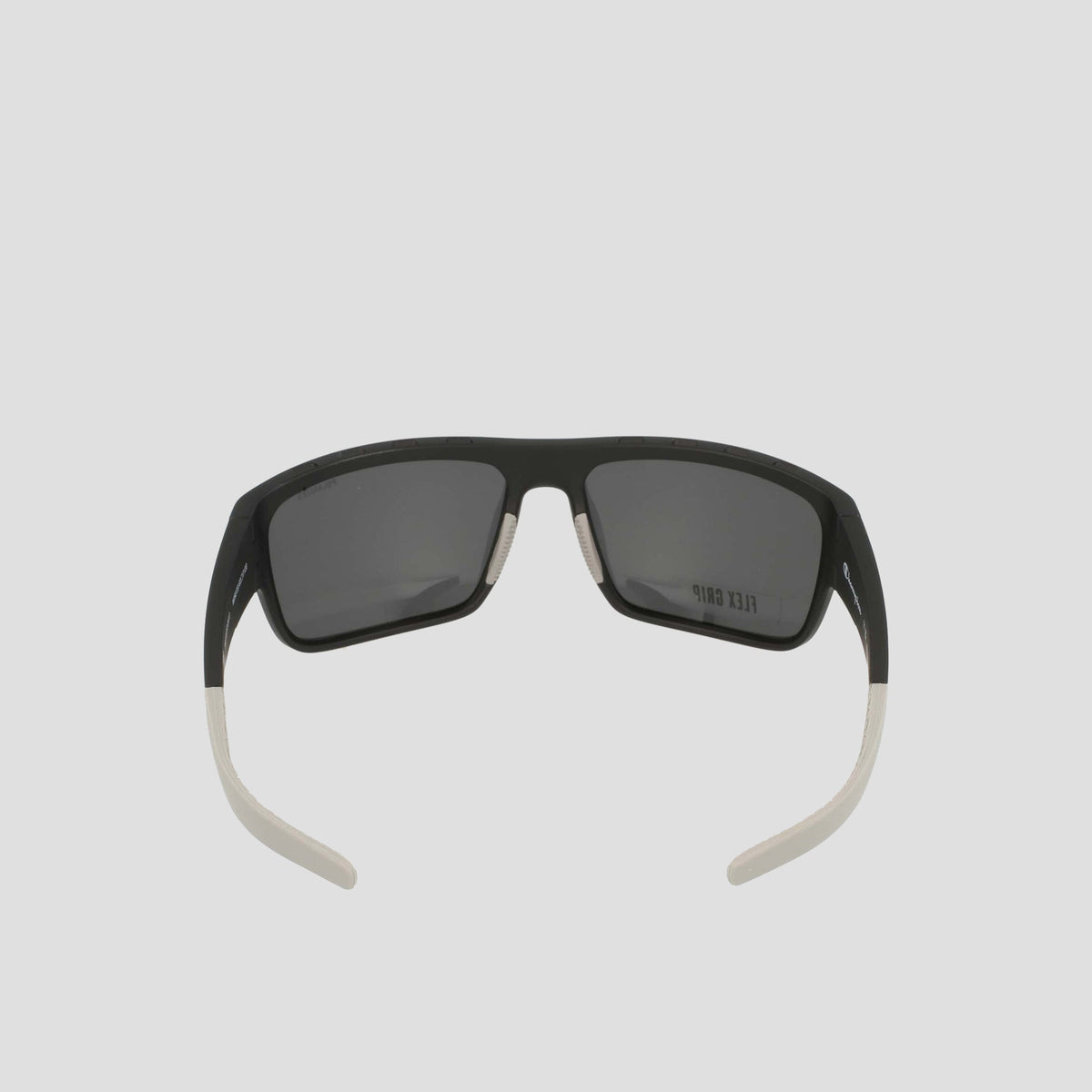 A pair of Champion Men's Polarized Grilamid Flex Grip Tip - Large sunglasses in black, featuring rectangular polarized lenses and distinctive white flex grip temple tips, displayed from the back with the arms slightly open against a plain light background.