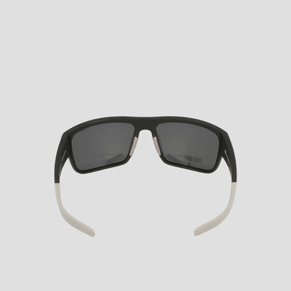 A pair of Champion Men's Polarized Grilamid Flex Grip Tip - Large sunglasses in black, featuring rectangular polarized lenses and distinctive white flex grip temple tips, displayed from the back with the arms slightly open against a plain light background.
