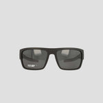 A pair of Champion Men's Polarized Grilamid Flex Grip Tip - Large sunglasses, featuring a black rectangular frame with dark lenses, is displayed against a light gray background. The left lens displays the white "FLEX GRIP" text. Designed for ultra-lightweight comfort, these sunglasses also offer an RX-able frame for added versatility.