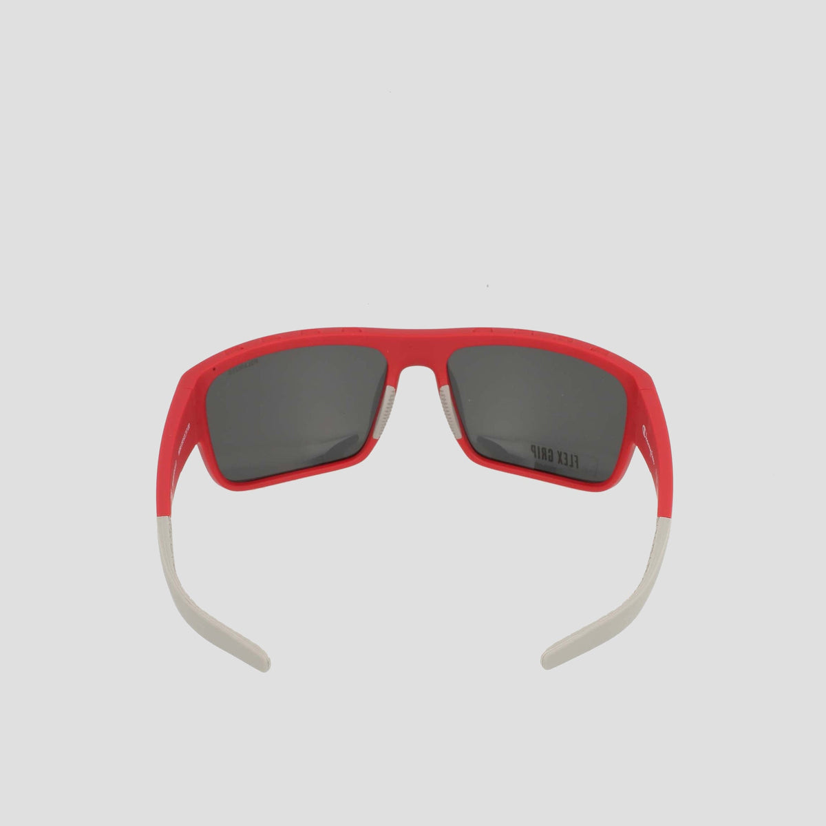 Champion Men’s Polarized Grilamid Flex Grip Tip - Large sunglasses with red frames, dark polarized lenses, and lightweight white arms. Displayed with open arms facing forward on a light gray background.
