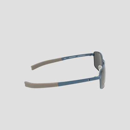 Men's Polarized Stainless ST-Shirtl Flex Grip Tip sunglasses by Champion, featuring blue frames with gray arms and dark polarized lenses for enhanced clarity, displayed from a side angle on a plain white background.