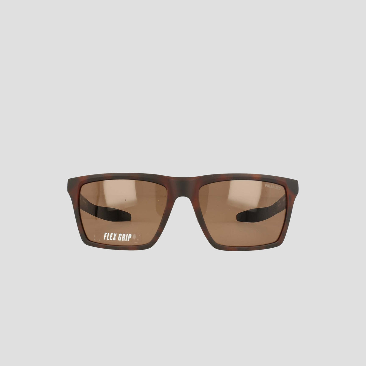 Champion Men's Polarized Grilamid Flex Grip Tip sunglasses in a medium size, featuring a brown rectangular RX-able frame and slightly tinted lenses. Displayed on a plain light gray background, the left lens displays the words "FLEX GRIP" in white text.