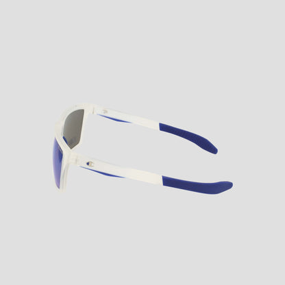 The Champion Men's Polarized Grilamid Flex Grip Tip - Medium sunglasses are displayed from a side angle on a plain, light gray background. Featuring a predominantly white frame complemented by blue arms and blue ear tips, these sunglasses are crafted from lightweight TR90 material for enhanced comfort and durability, making them ideal for everyday wear.